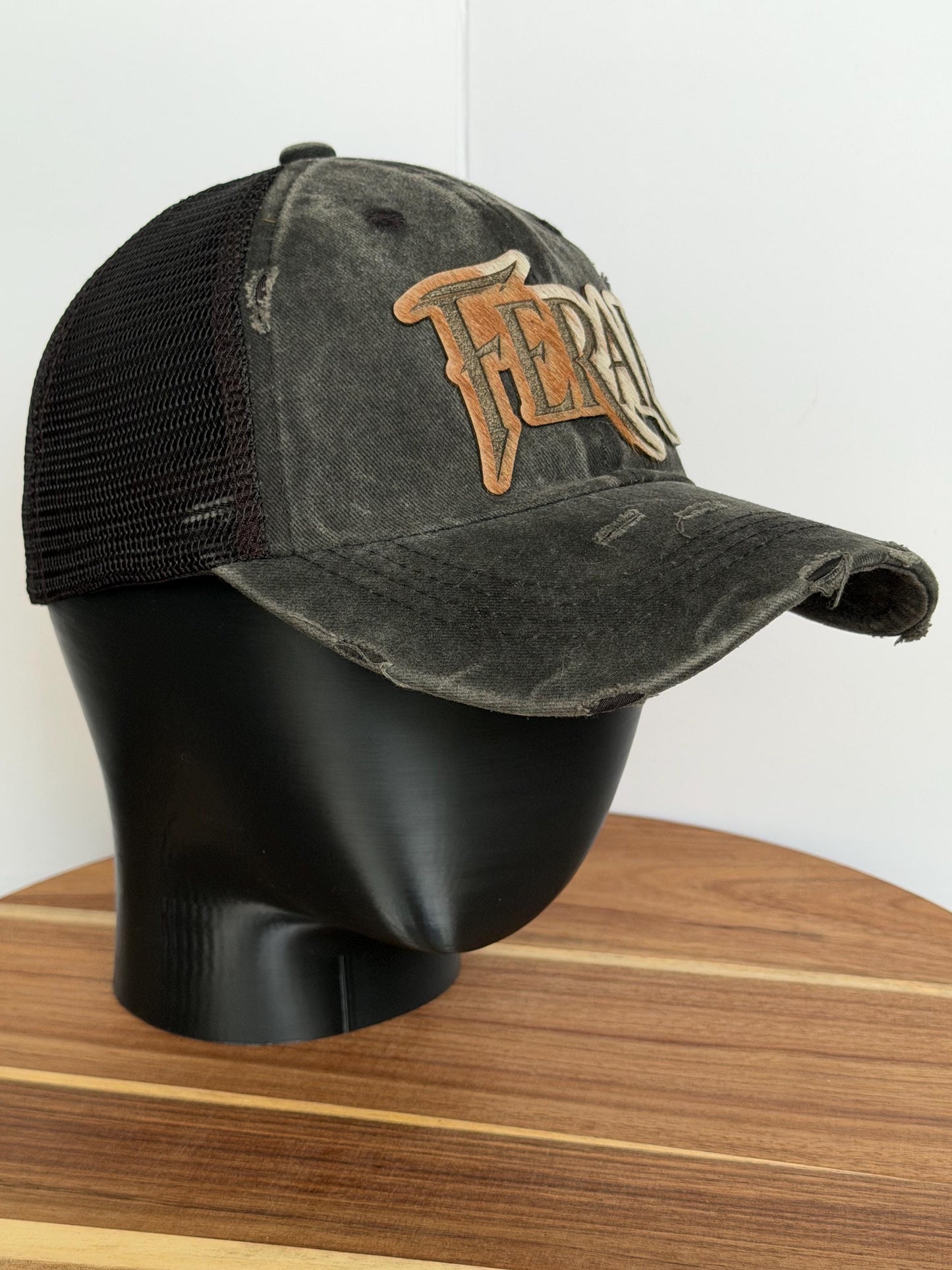 FERAL Trucker Hat – Hair-on-Hide Leather Patch | Distressed Black Ball Cap
