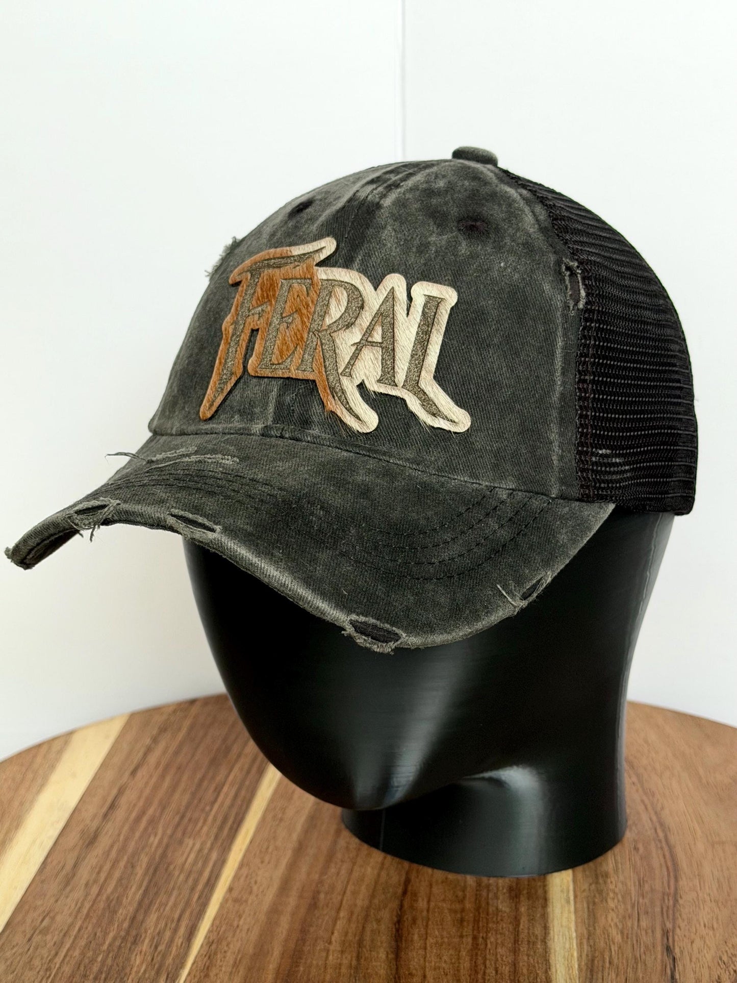 FERAL Trucker Hat – Hair-on-Hide Leather Patch | Distressed Black Ball Cap